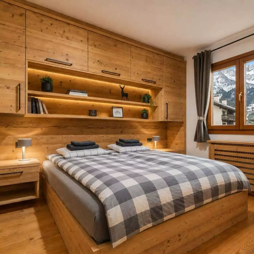 Arredamento rustico-moderno e funzionale in una camera di casa di montagna